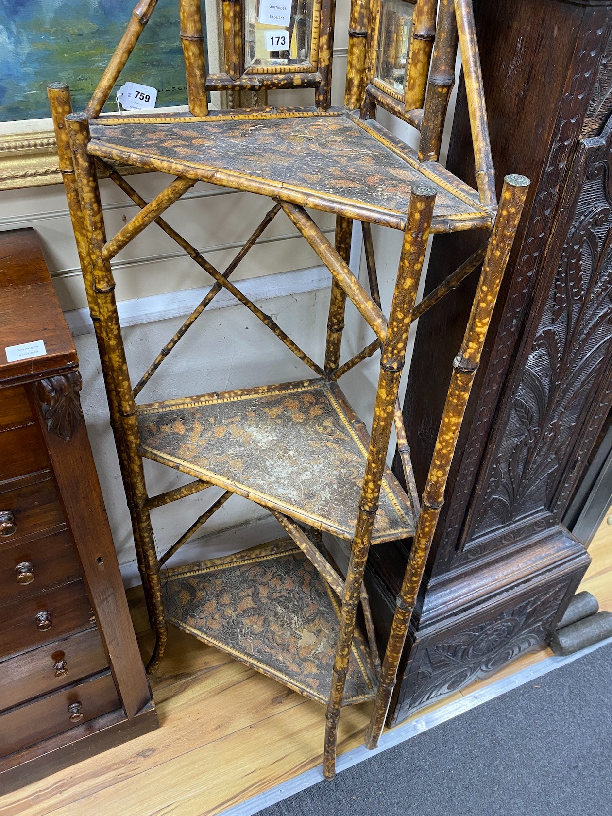 A Victorian bamboo mirrored three tier corner whatnot, width 61cm, depth 34cm, height 160cm